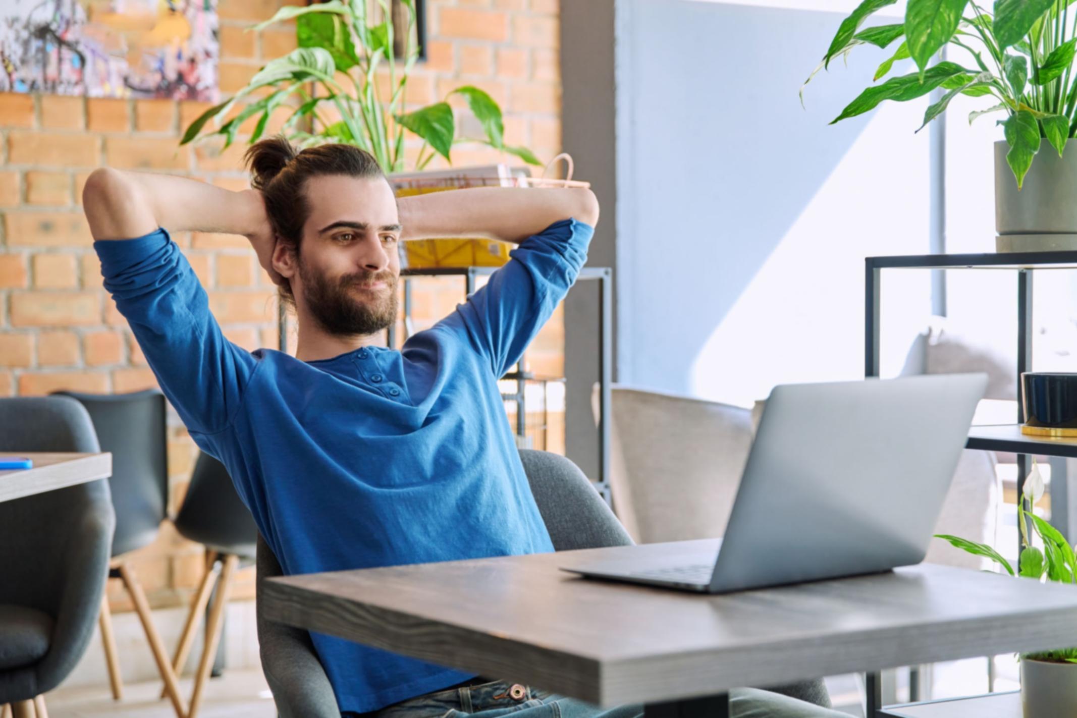 Collaborative workspace showing game design sketches and mobile testing devices