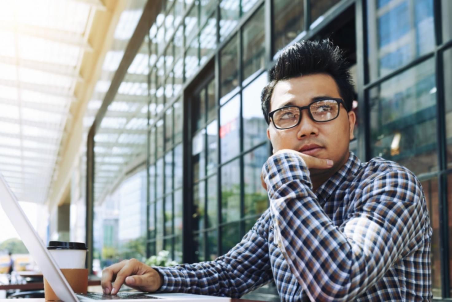 Students collaborating on mobile game prototypes in workshop environment